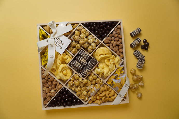 Rosh Hashanah chocolate and nuts platter with kosher chocolates, honey candies, nuts and festive treats arranged for the Jewish New Year