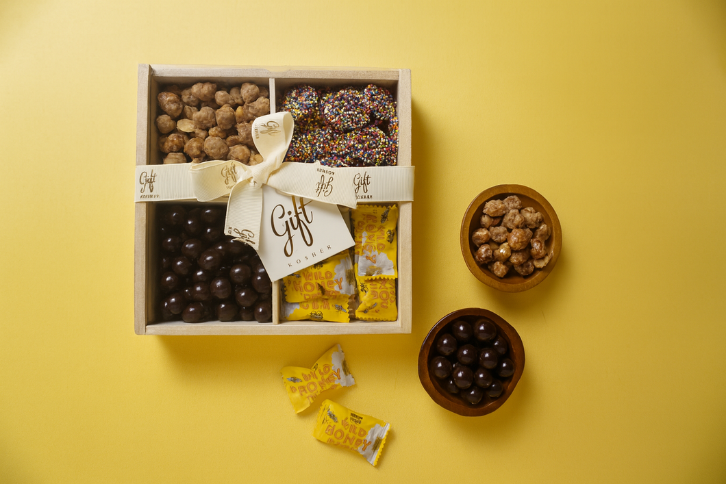 Kosher Rosh Hashanah gift box assortment of chocolates, honey candies, and festive treats